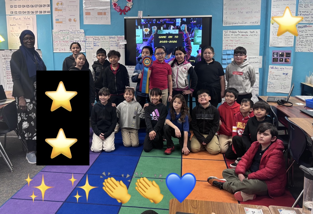 3rd grade classroom posing with ribbon
