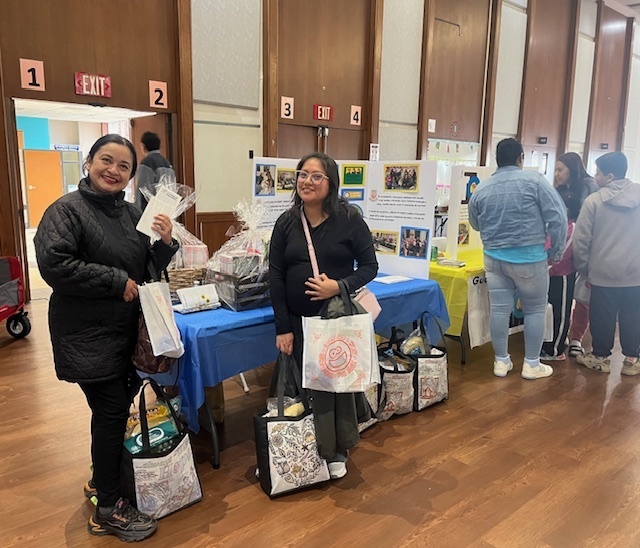 Picture of parents holding bags