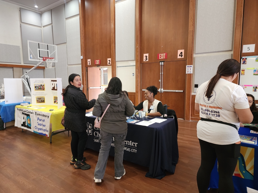 People getting information from a table.
