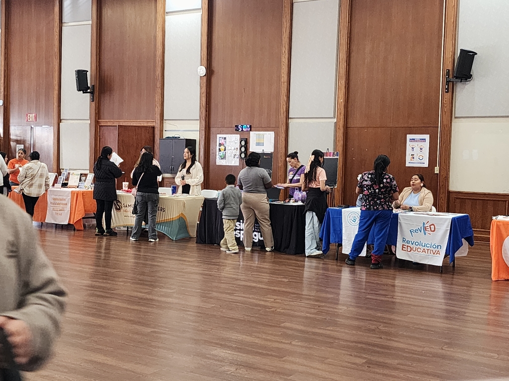 People taking to different table organizations.