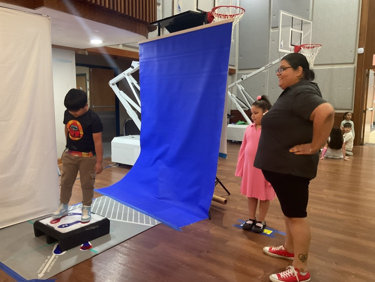 student getting ready to take a professional picture