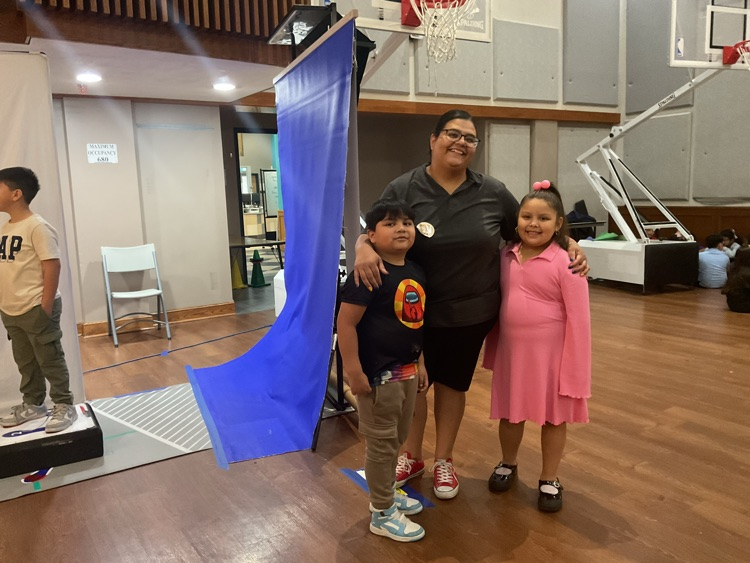 volunteer and children posing for the camera