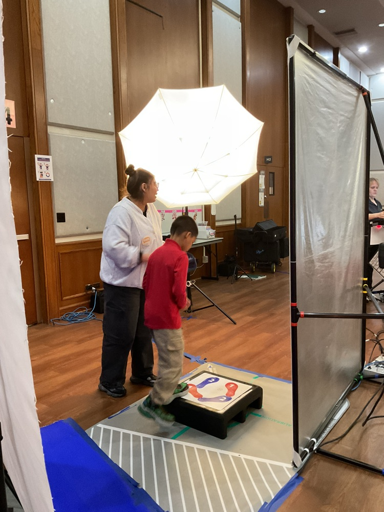 student getting ready to take a professional picture