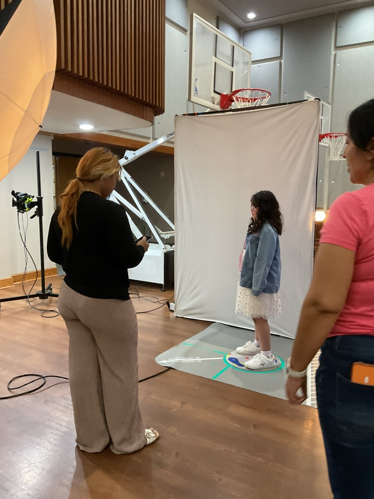 student getting ready to take a professional picture