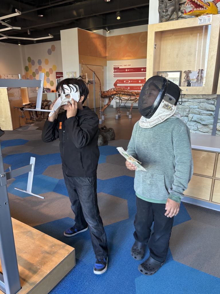 2 students wearing a mask 