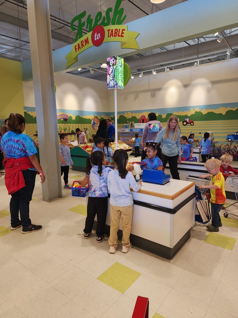children playing and pretending that they are in a store 