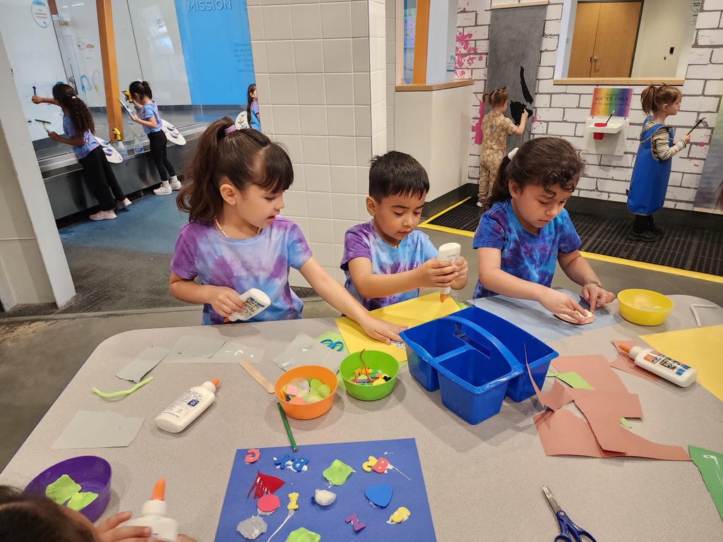 children playing and doing craft in a museum