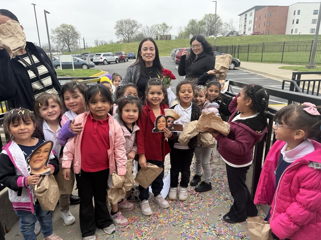 Assistant Principal receiving recognition from the students and staff of the Pre-K school.