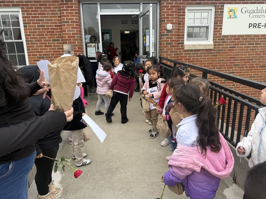 Assistant Principal receiving recognition from the students and staff of the Pre-K school.