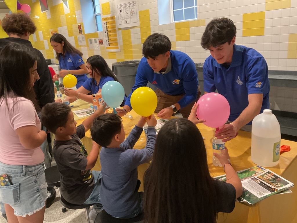 Students inflating a balloon 