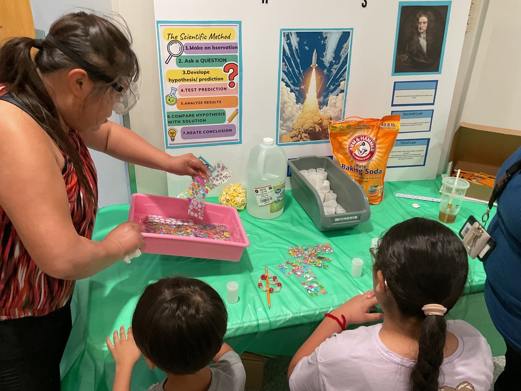 Teacher showing students stickers 