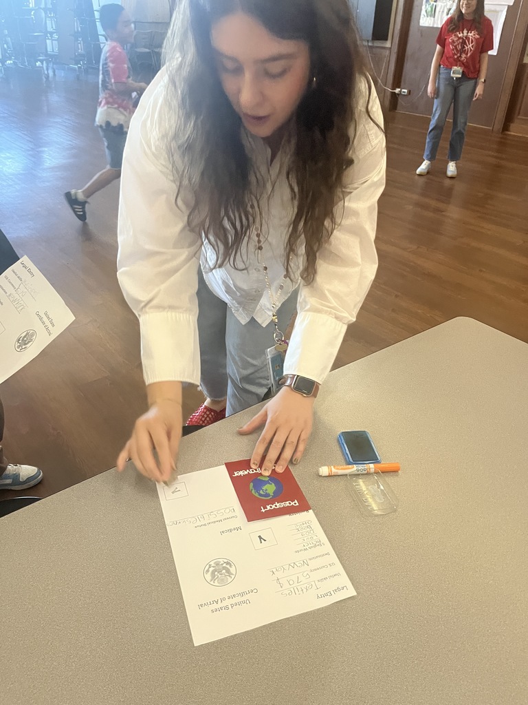 Teacher getting a passport stamp 