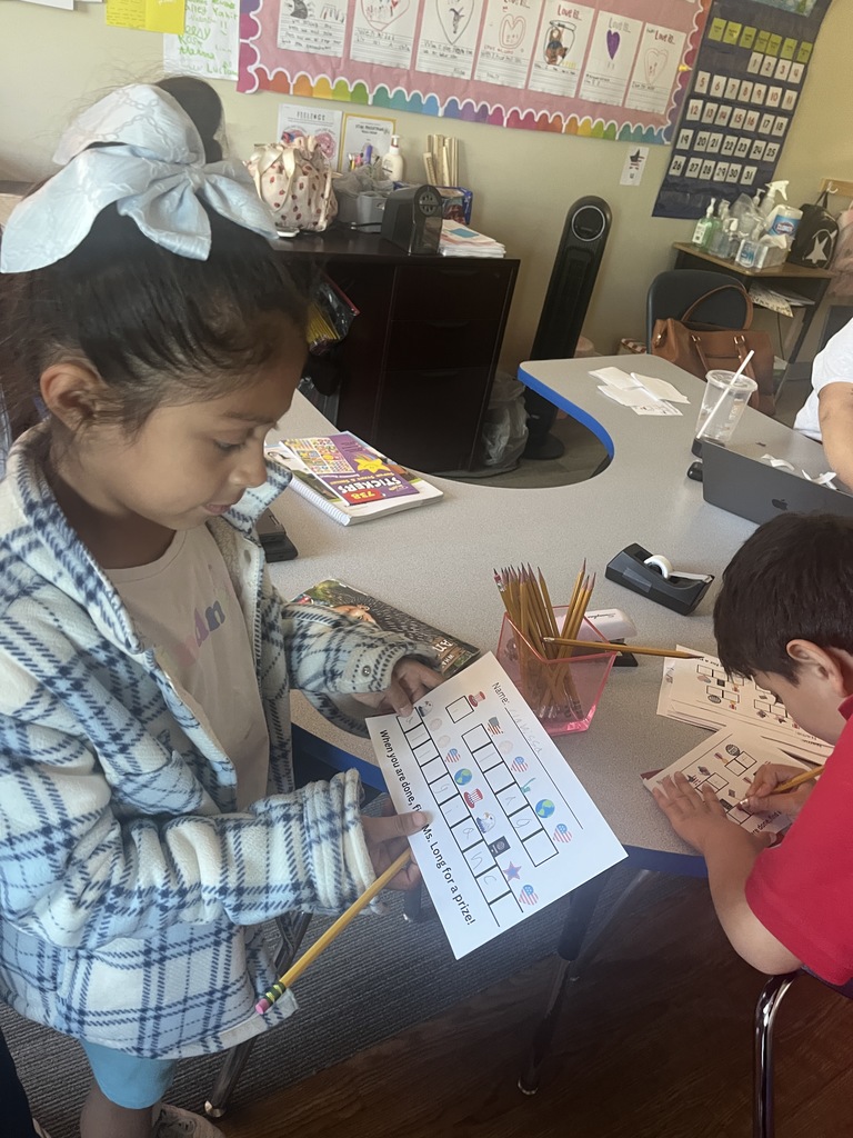 Girl looking at the writing code activity 