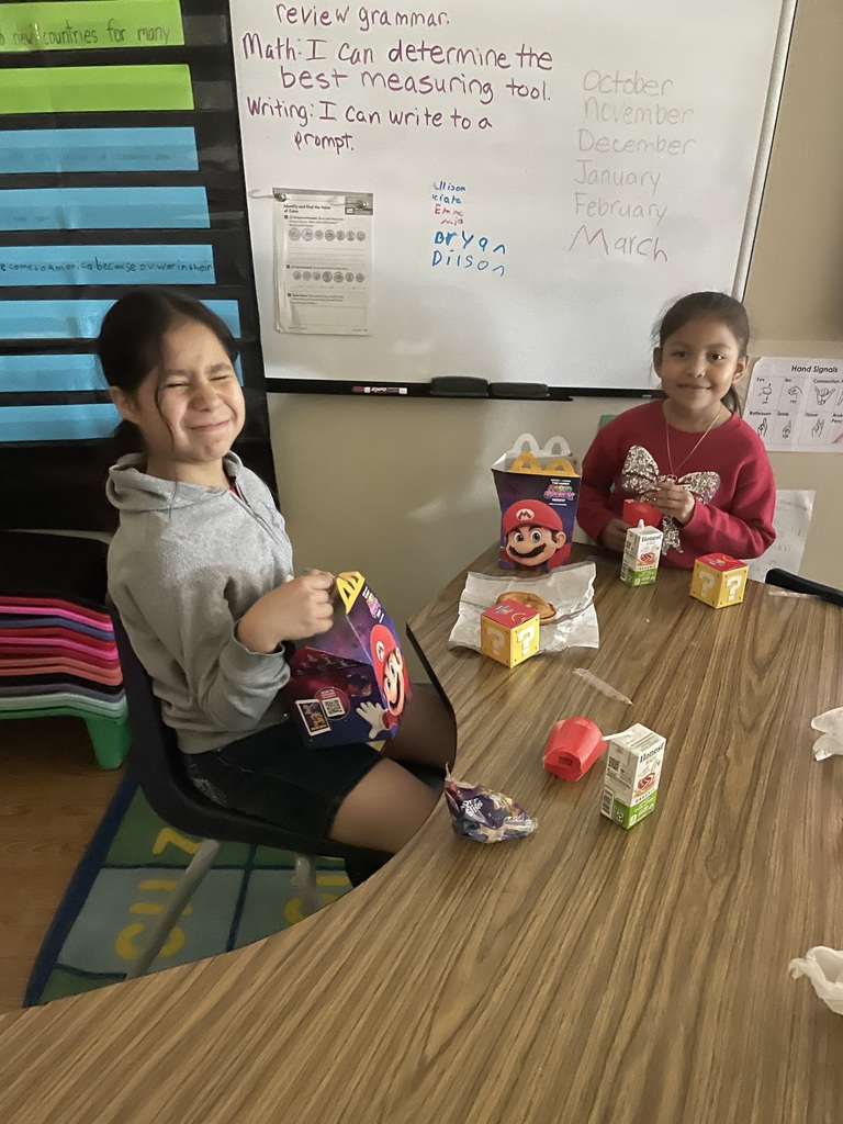 2 students eating a happy meal