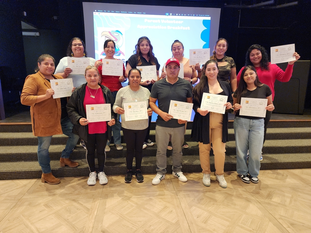 Group of people holding a certificate