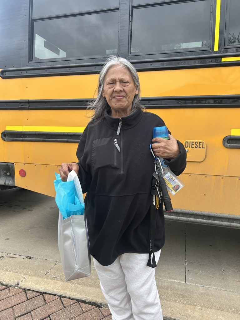 A female school bus driver with gift 