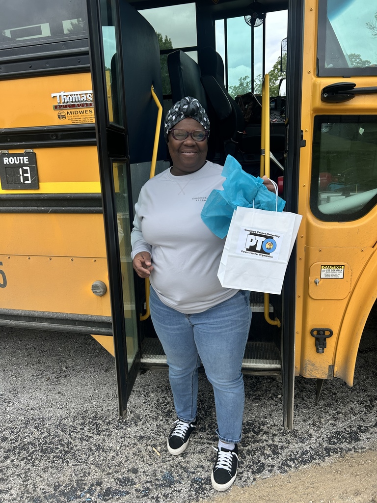 A female school bus driver with gift 