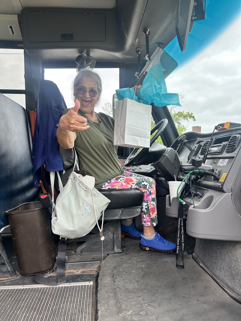 A female school bus driver with gift 