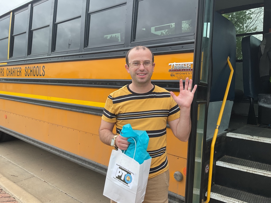 A male school bus driver with gift
