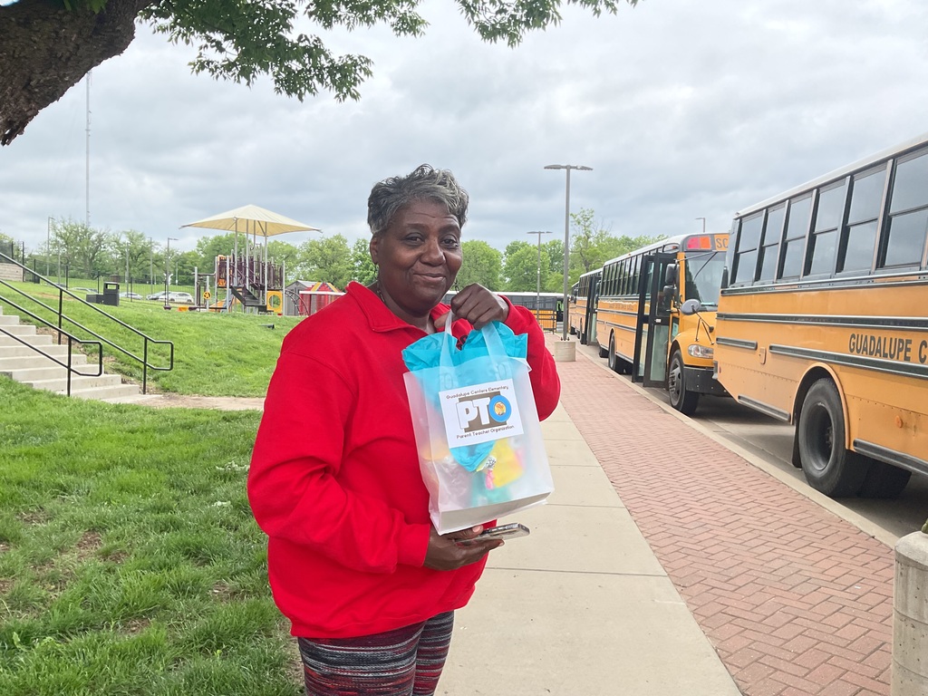 A female school bus driver with gift