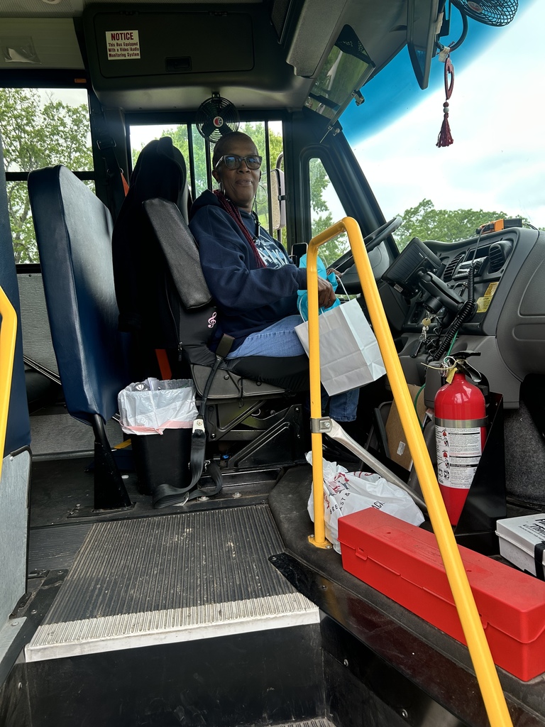 A female school bus driver with gift 