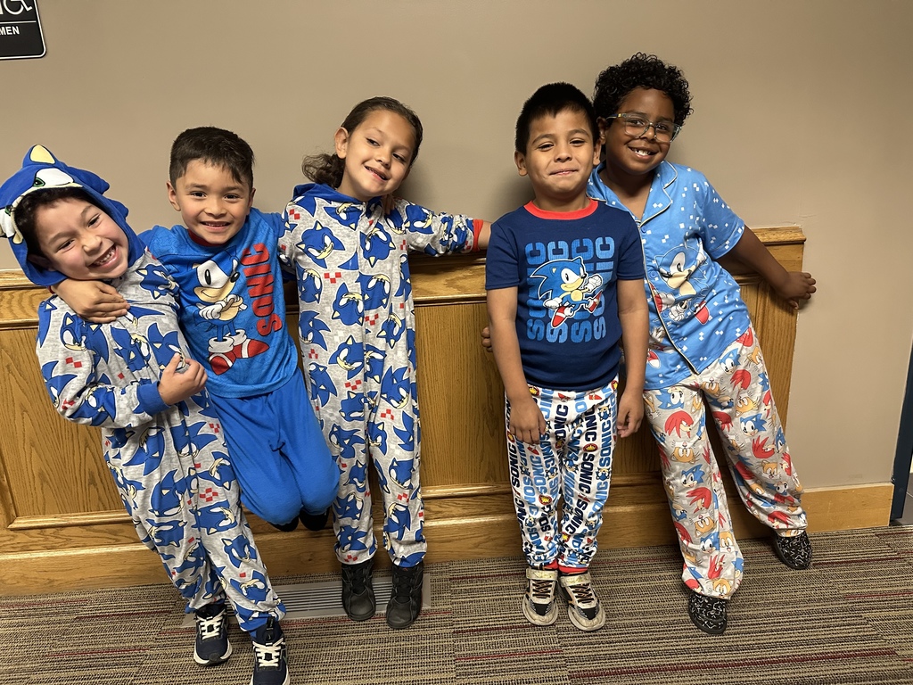 5 kids wearing pajamas , celebrating the spirit week 