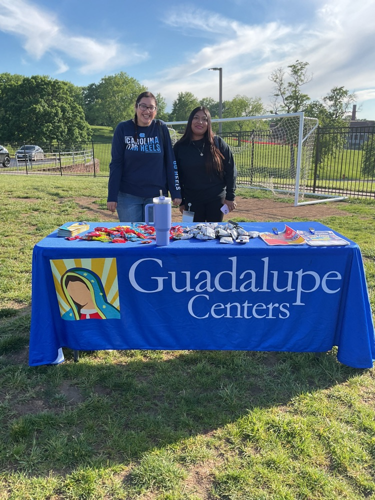 two people on a table that says Guadalupe Centers
