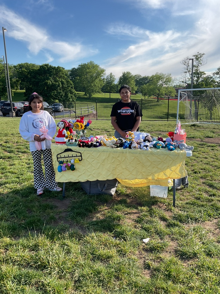 a table selling crochet art