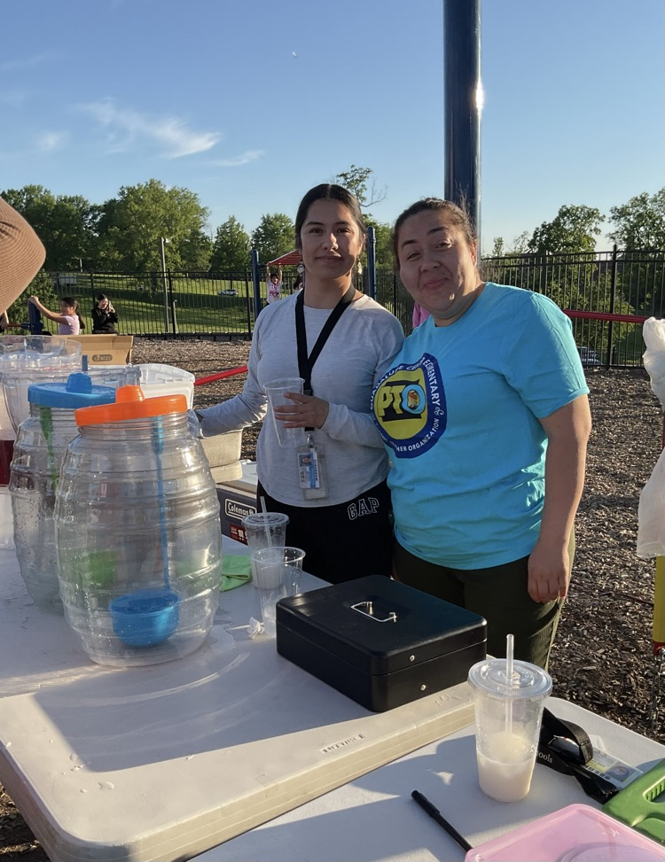 2 women selling drinks 