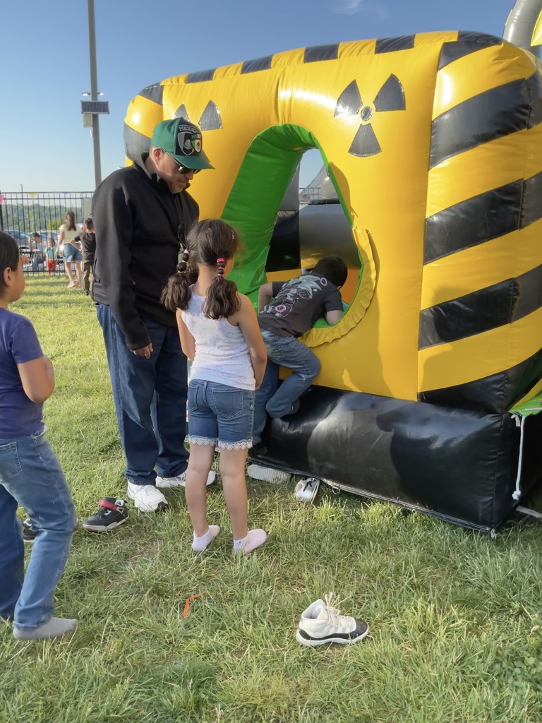 kids lining up to enter the inflatable castle