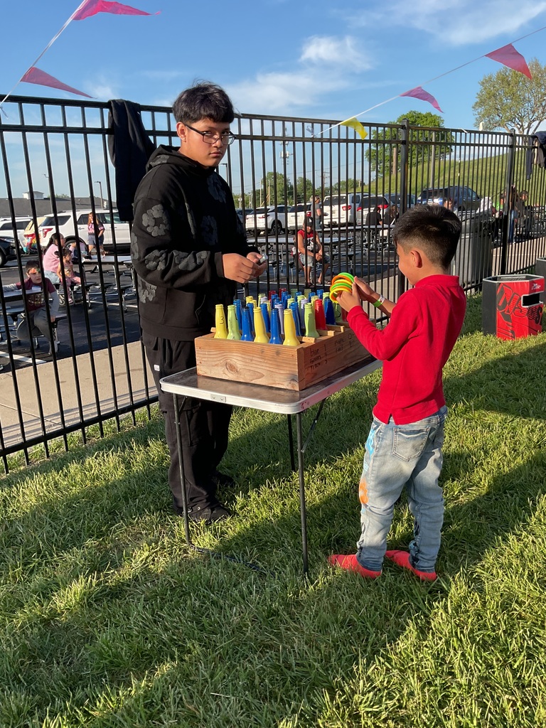 A Boy playing a carnival game