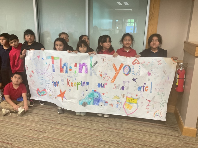 kids holding a sign that says thanks for keeping us safe