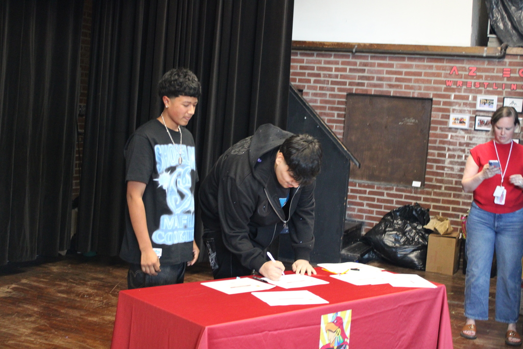 students signing 