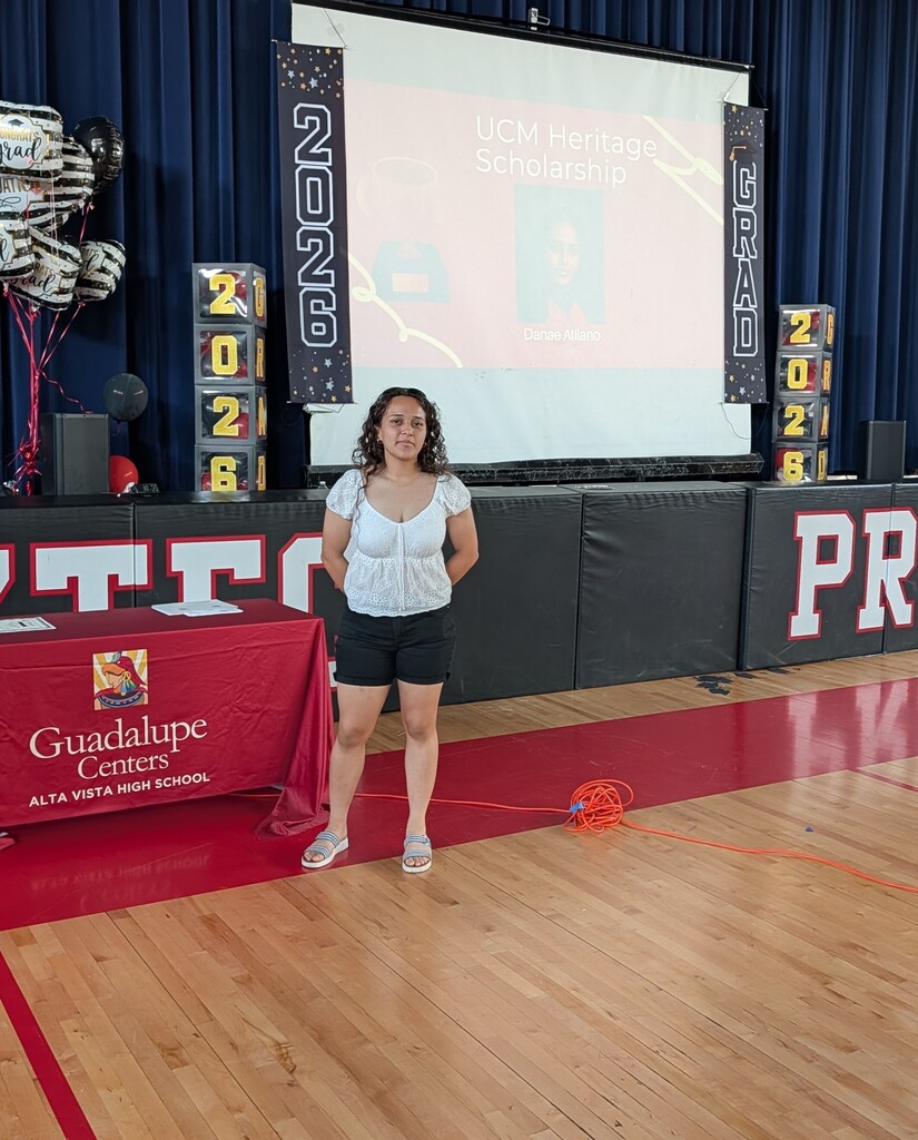 student standing in front of a screen