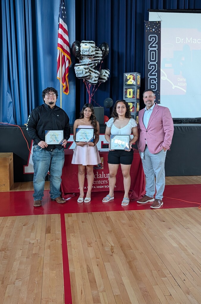 students standing in front of a screen