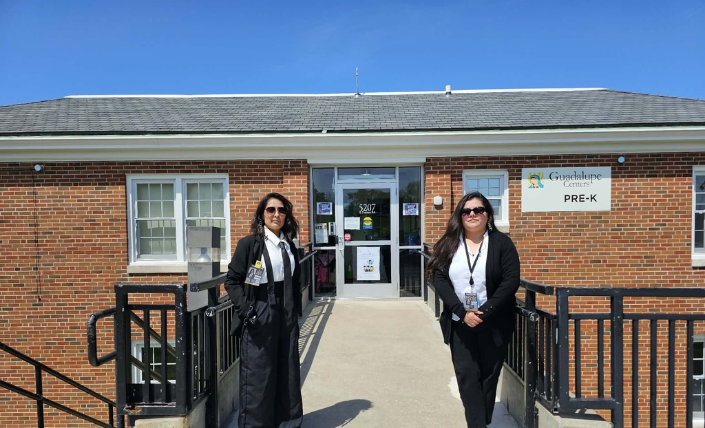 teachers of school staff dressed as spies, wearing dark sunglasses and black.