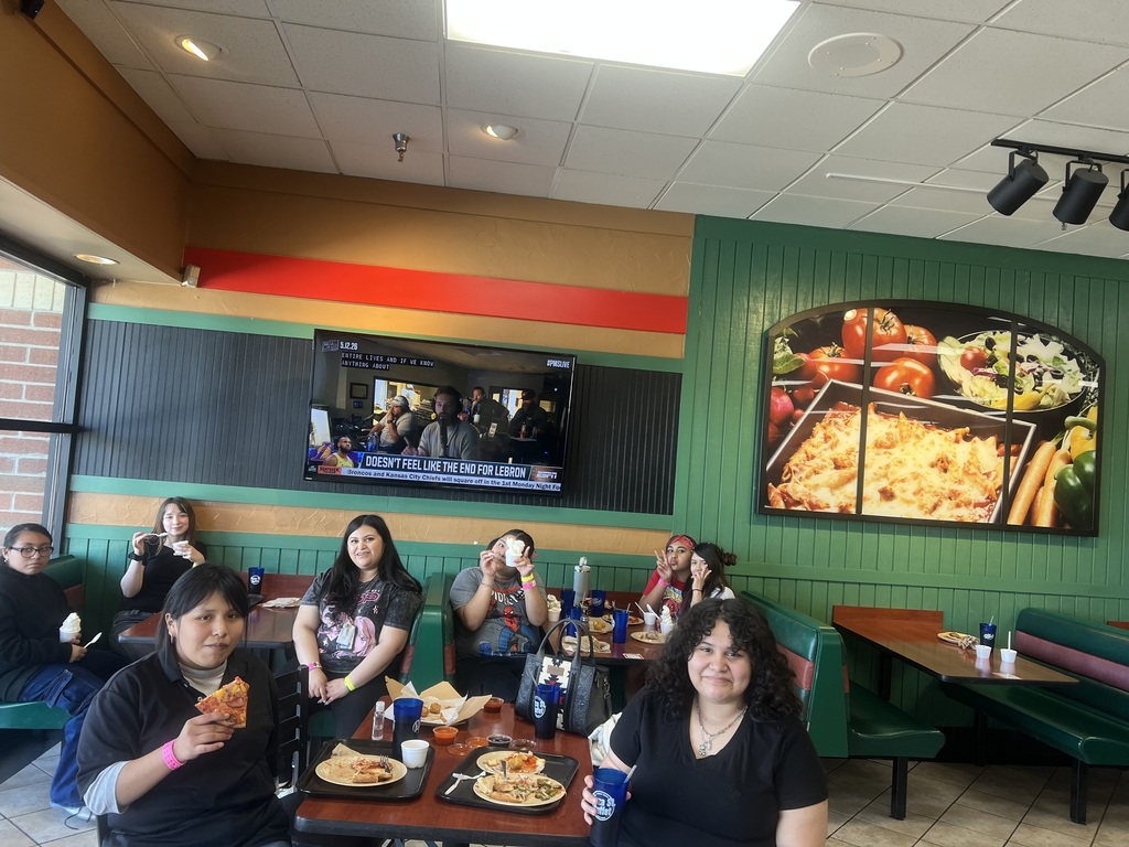 students and teachers eating at pizza street