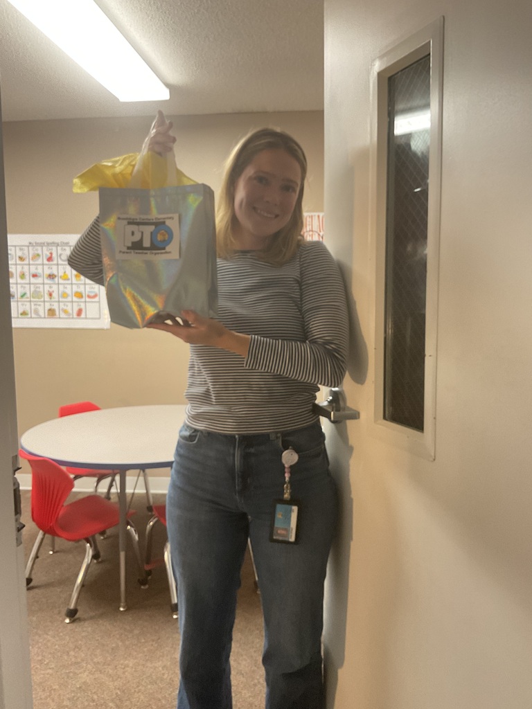 A woman holding a gift bag