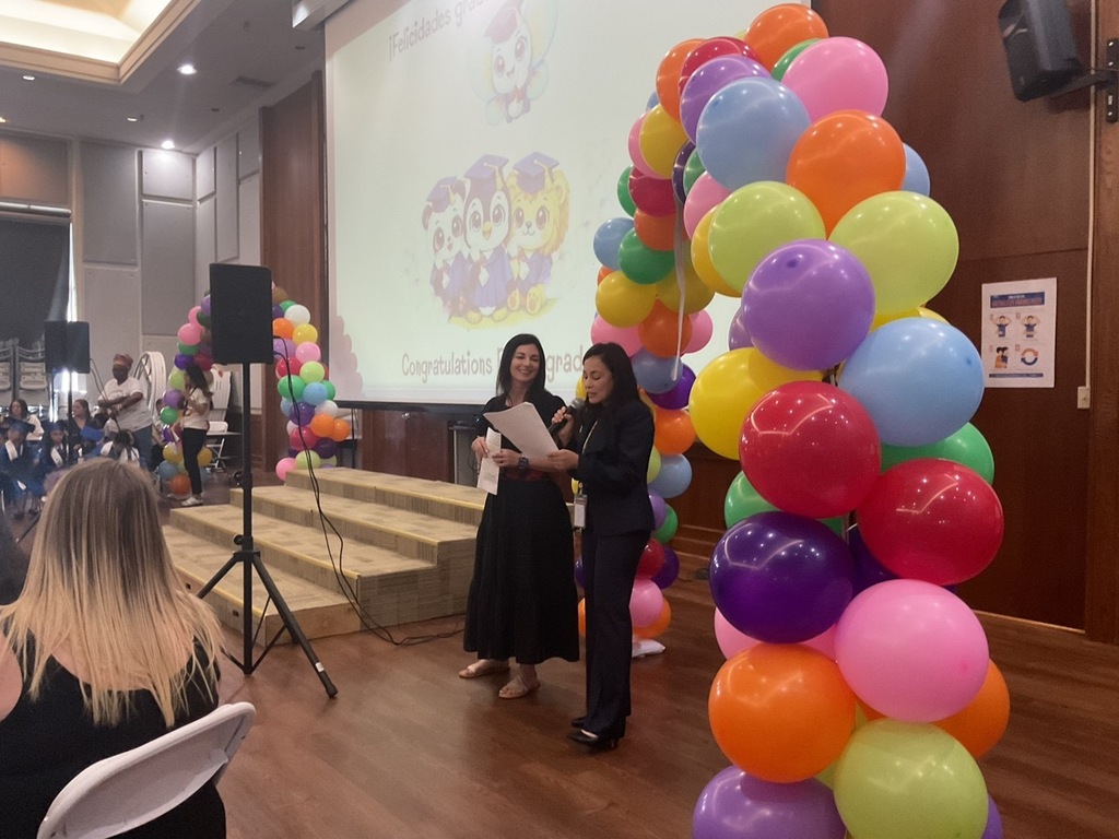 Principal and assistant principal of a Pre-K school leading the Pre-K graduation ceremony.
