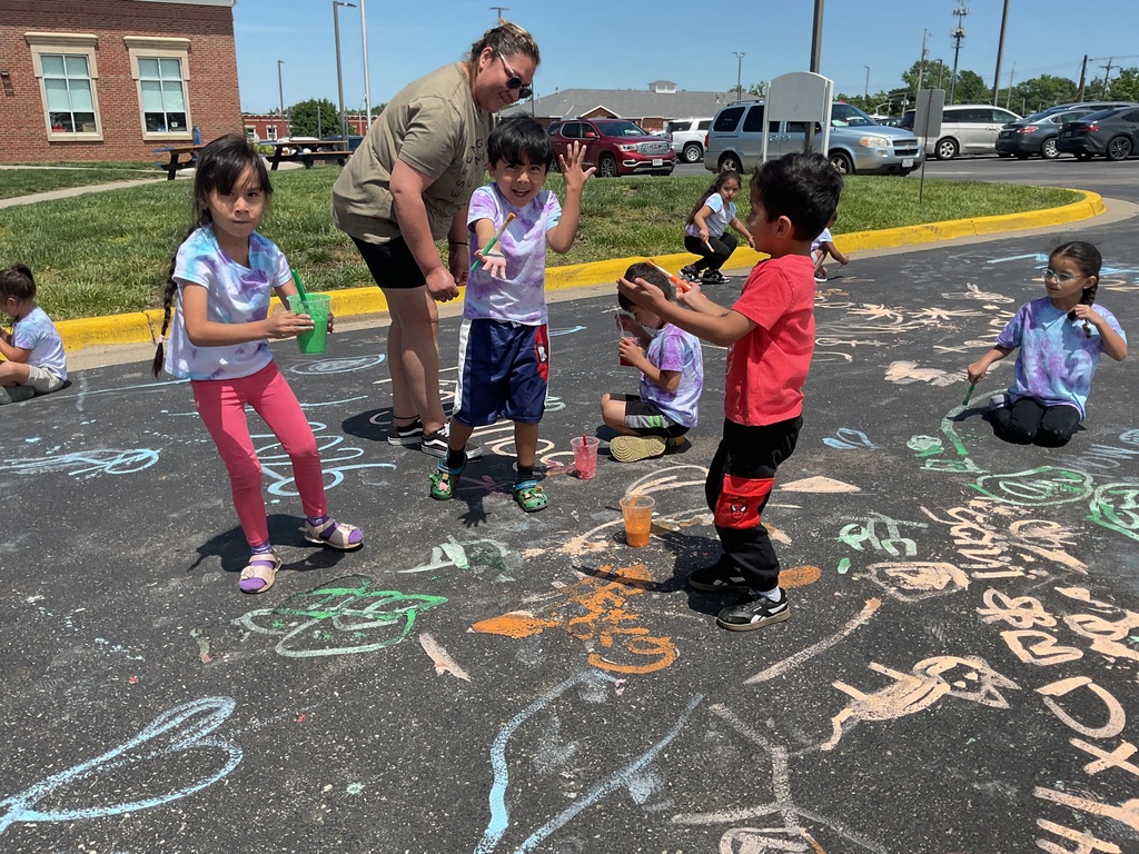 Some children playing with paints