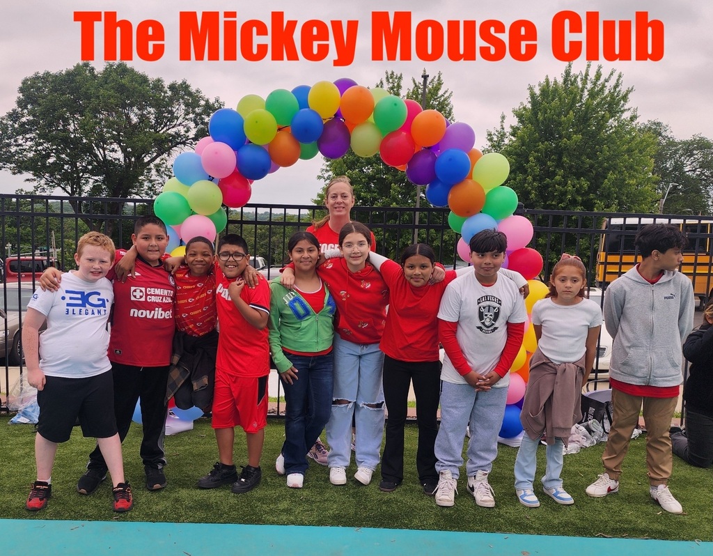 A group of students called the mickey mouse club posing for a picture