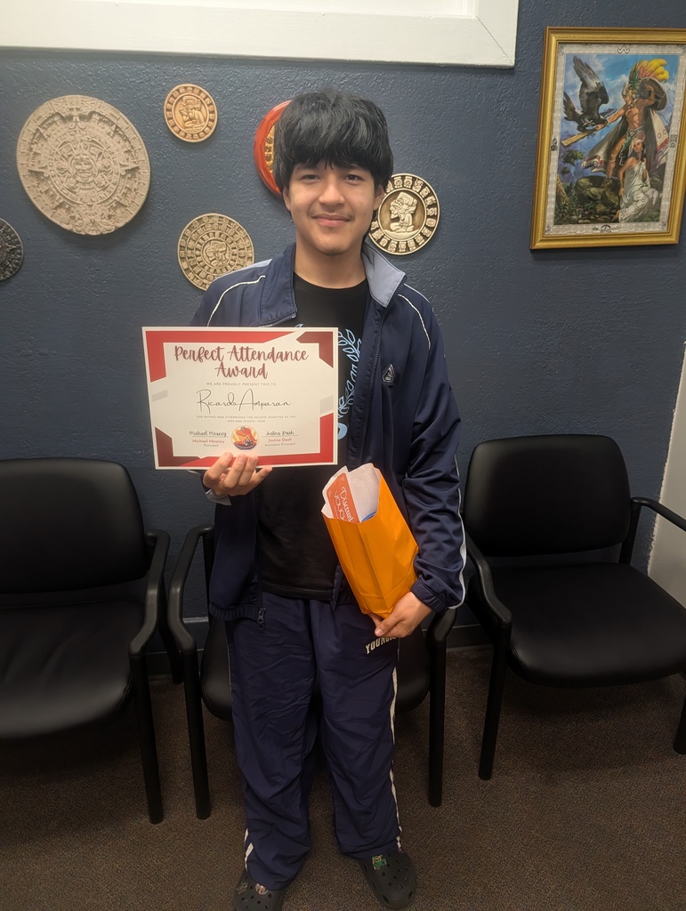 a student holding a certificate