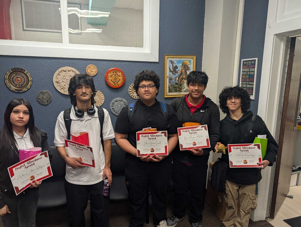 a group of students posing with certificates