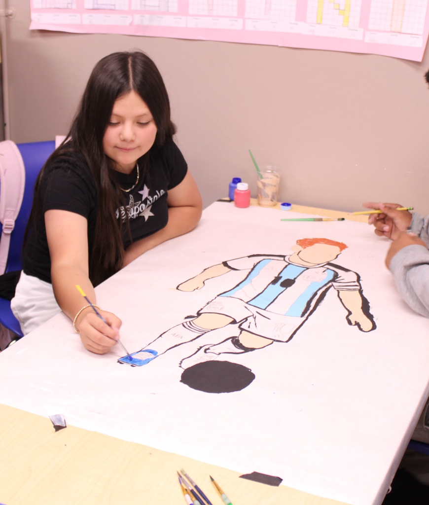 3rd grade painting a futbol player