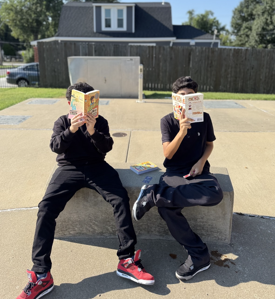 Students covering their faces with books