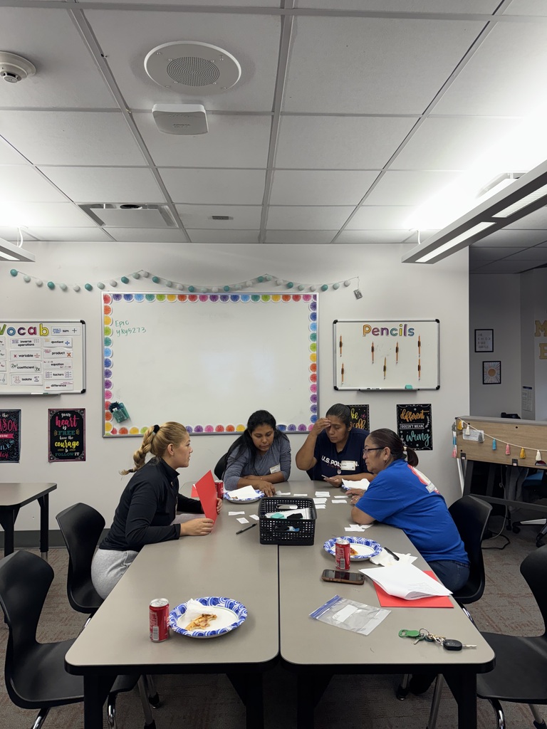 parents working together on a long gray table