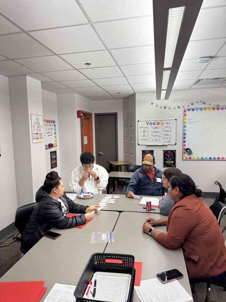 parents and our staff member working together on the table