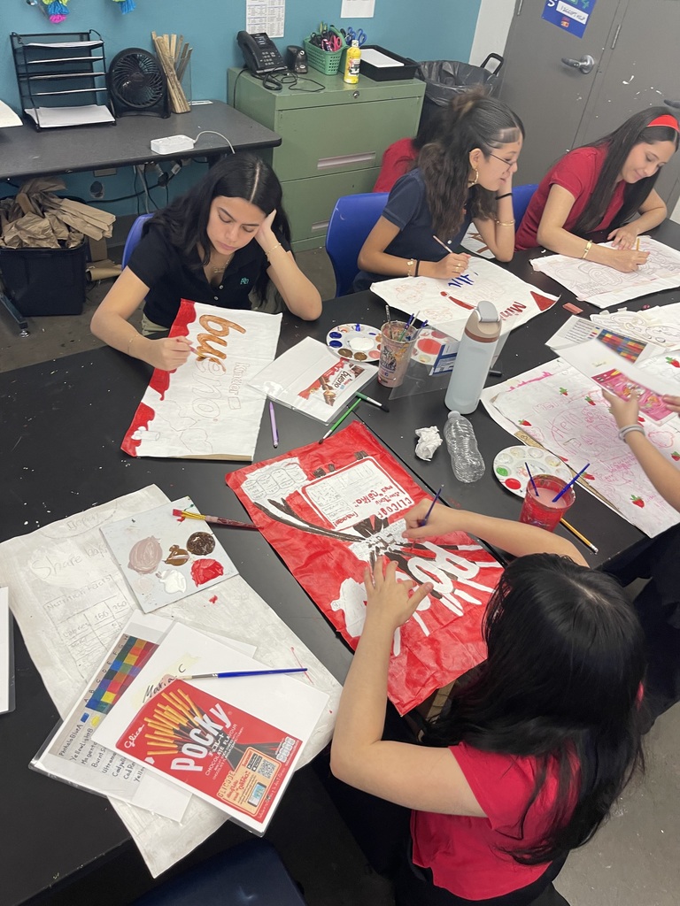 students in art class being creative making their pop art bags