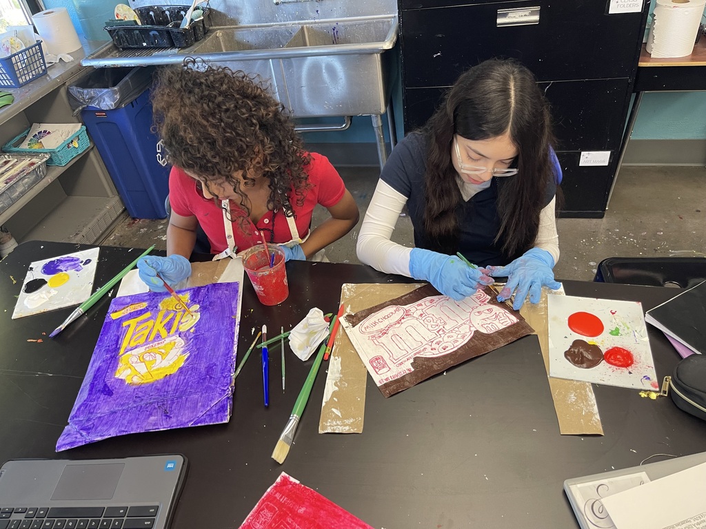 students in art class being creative making their pop art bags