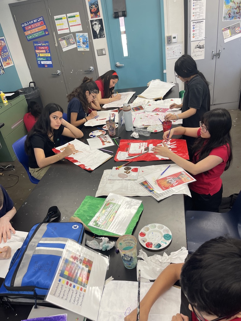 students in art class being creative making their pop art bags